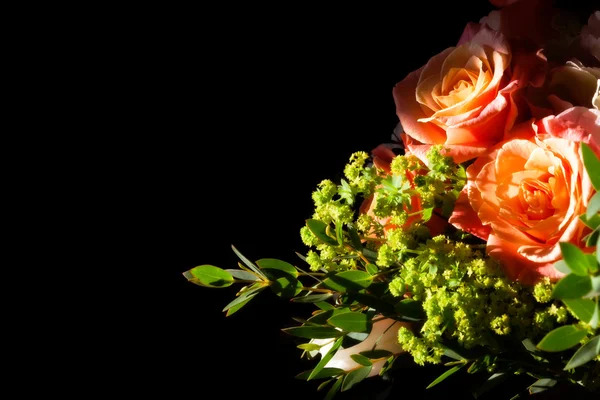 Amazing bouquet of roses on black lit by the sun — Stock Photo, Image