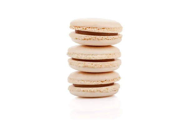 Three delicious beige colored macaroons isolated — Stock Photo, Image