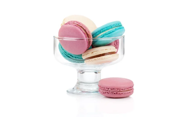 Colorful macaroons in a glass vase isolated — Stock Photo, Image