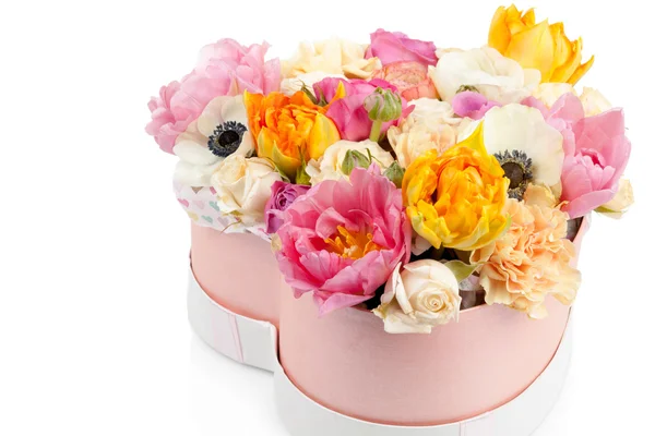 Flower bouquet in a heart shaped box isolated on white Royalty Free Stock Images