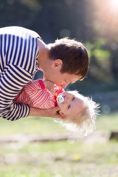 Father holding little laughing child Royalty Free Stock Photos