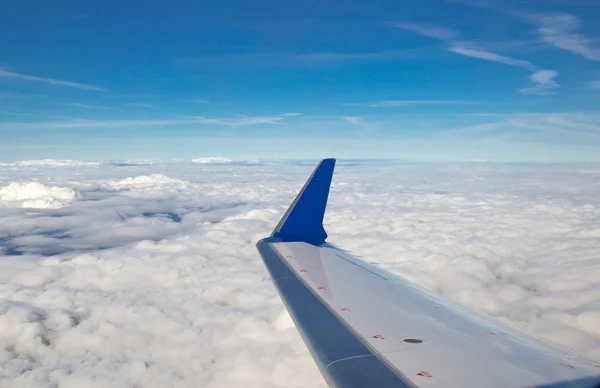 Aircraft wing and clouds Royalty Free Stock Images