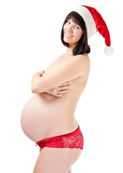 Donna incinta in cappello da Babbo Natale — Foto Stock