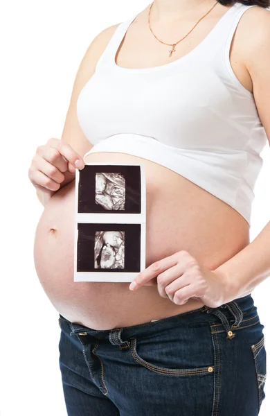 Pregnant young woman showing ultrasound picture — Stock Photo, Image