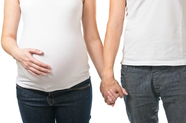 Terhes nő és férfi tartja kezében — Stock Fotó