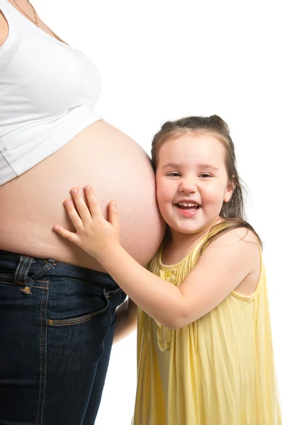 Menina com mãe grávida — Fotografia de Stock