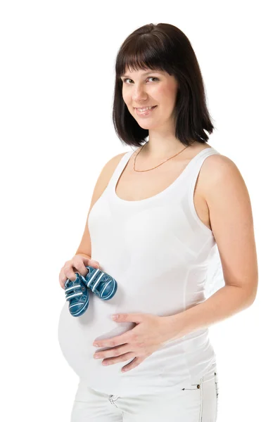 Young pregnant woman holding booties — Stock Photo, Image