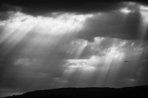 Sun rays pass through clouds after a storm in Galicia (Spain)