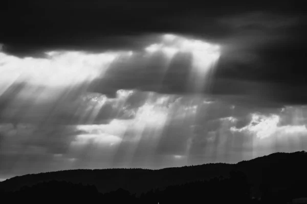 Sun rays pass through clouds after a storm in Galicia (Spain)