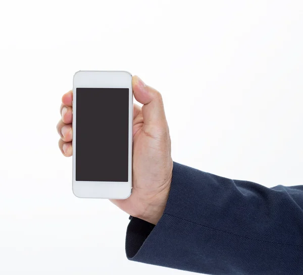 Podnikatel ruka drží mobilní telefon na bílém pozadí — Stock fotografie