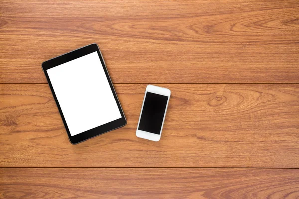 Mobiltelefon och tillbehör på trä bakgrund — Stockfoto