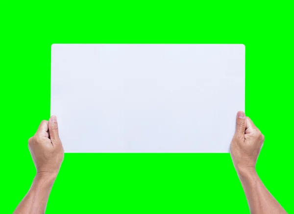 Mãos segurando papel em branco isolado no fundo verde — Fotografia de Stock