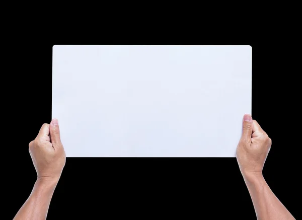 Hands holding blank paper isolated on black background — Stock Photo, Image