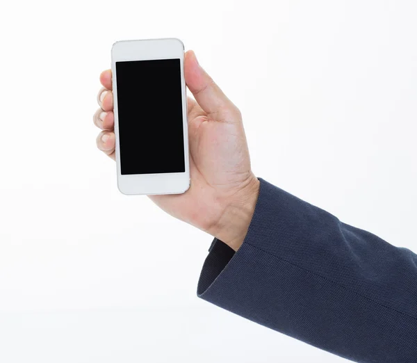 Üzletember kezében mobiltelefon fehér háttér — Stock Fotó