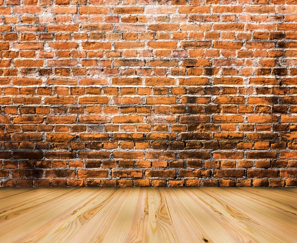 Wood floor with old brick wall background — Stock Photo, Image