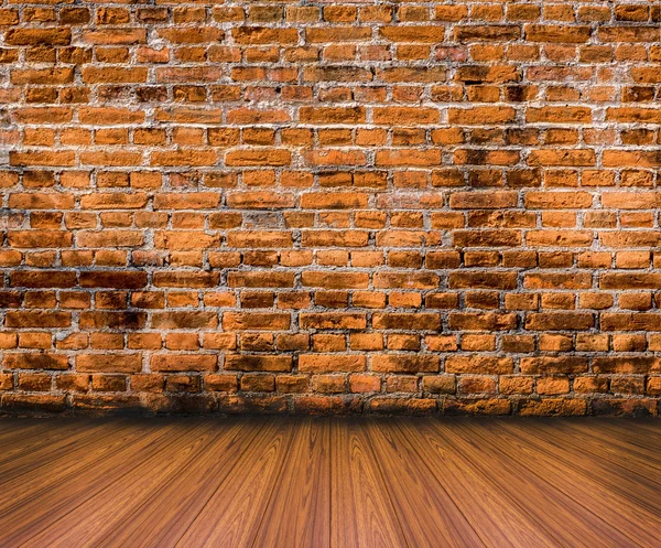 Wood floor with old brick wall background — Stock Photo, Image