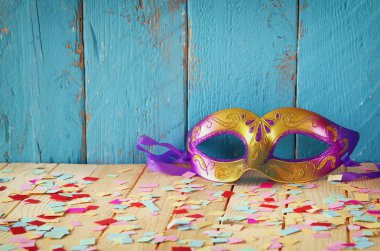 colorful Venetian masquerade mask. selective focus. vintage filtered