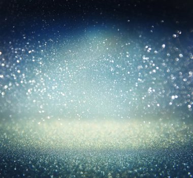 Glitter vintage ışıklar arka plan. Altın, gümüş, mavi ve siyah. de-odaklı.