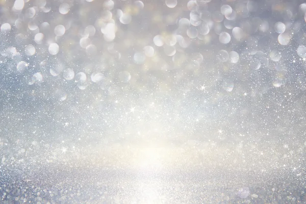 Glitter vintage lights background. gold, silver, blue and white. de-focused. — Stock Photo, Image