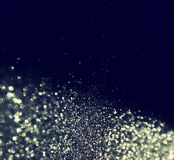 Glitter vintage lights background. gold, silver, blue and black. de-focused. — Stock Photo, Image