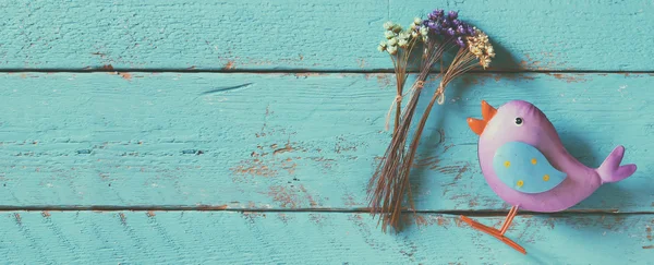 website banner background of dried colorful flowers on old blue wooden background