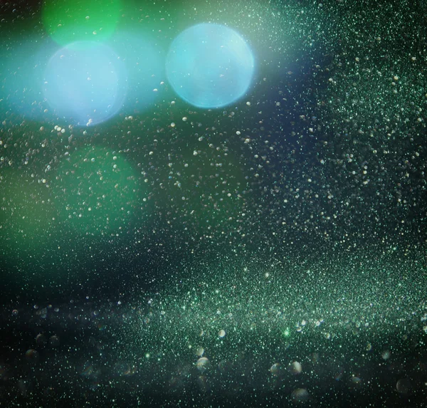 Glitter vintage lights background. gold, green and black. defocused. — Stock Photo, Image