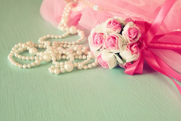 Small girls party outfit: crown and wand flowers on wooden table. bridesmaid or fairy costume. vintage filtered with glitter overlay. selective focus — 스톡 사진