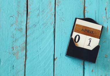 image of April First wooden vintage calendar on white background