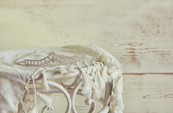 stock image image of diamond tiara on vintage table. vintage filtered. selective focus