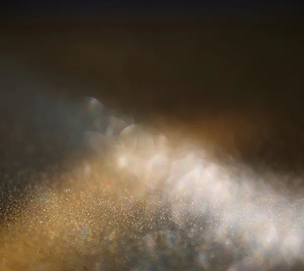 Glitter vintage lights background. gold and black. defocused. — Stock Photo, Image