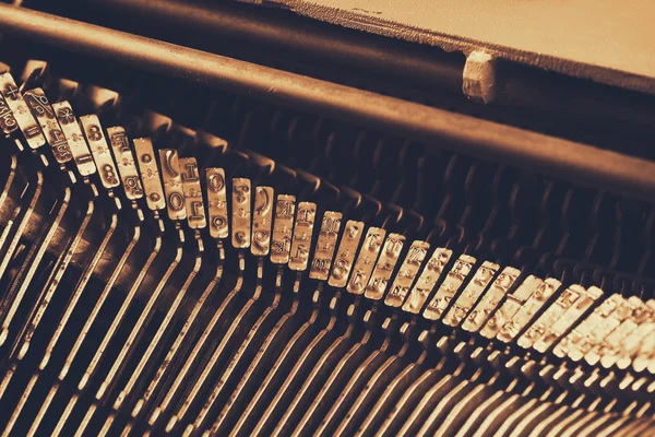 Close up image of metalic tapewriter keys. vintage filtered. selective focus — Stock Photo, Image