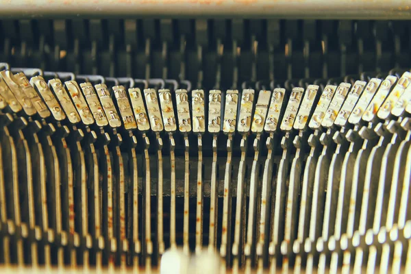 Close up image of metallic typewriter keys. vintage filtered. selective focus — Stock Photo, Image