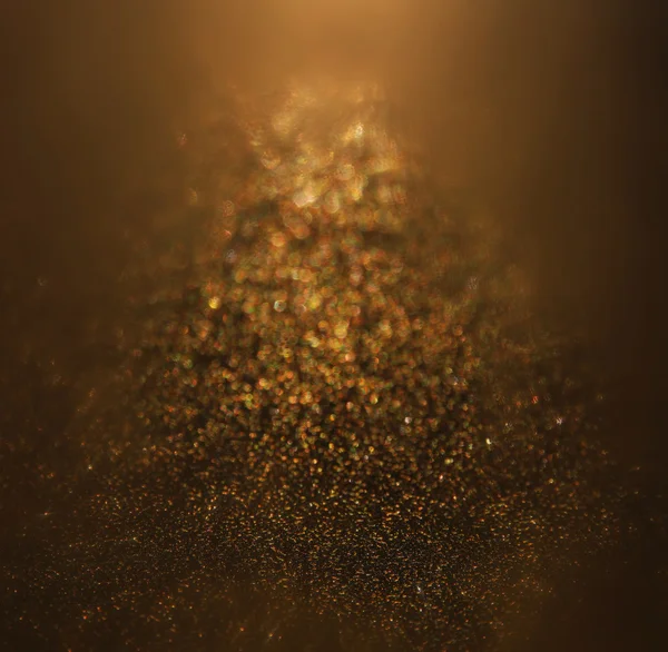 Glitter vintage lights background. gold and black. defocused. — Stock Photo, Image