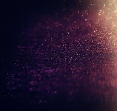 Glitter vintage ışıklar arka plan. altın rengi ve siyah. defocused.