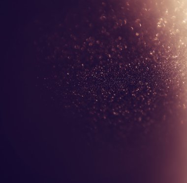 Glitter vintage ışıklar arka plan. altın rengi ve siyah. defocused