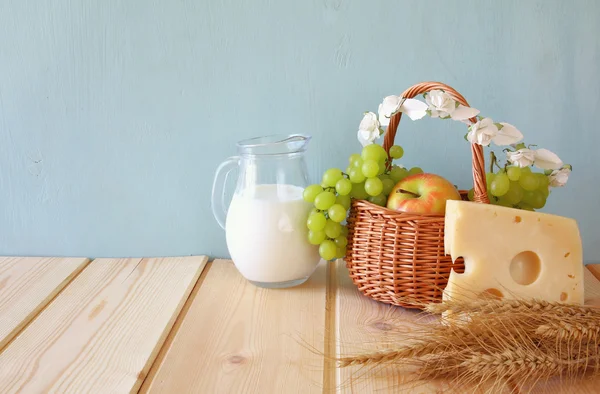 dairy products and fruits on wooden table Stock Photo