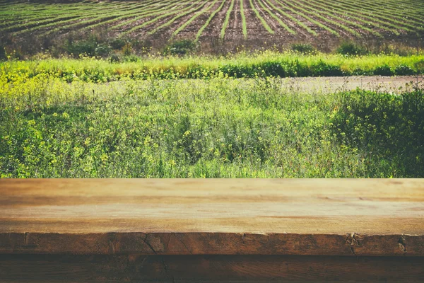 Front rustic wood boards and agriculture field — Stock Photo, Image