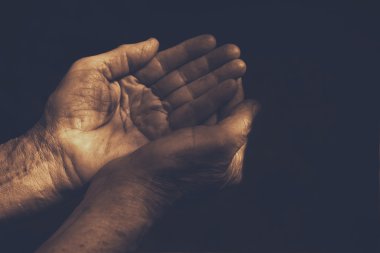 male Wrinkled old hands begging. compassion concept clipart