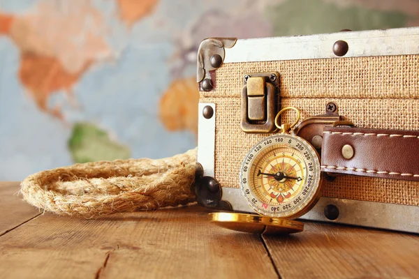 Traveler vintage luggage and compass on table — Stock Photo, Image