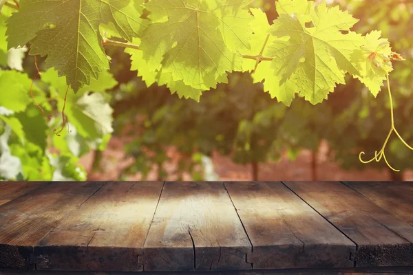 Wooden table in front of Vineyard landscape — Stock Photo, Image