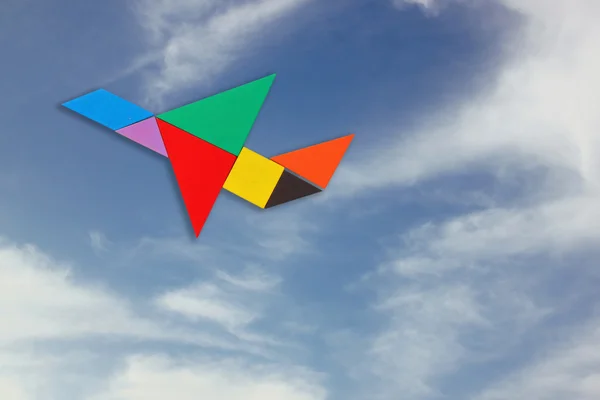 Avión hecho de rompecabezas tangram —  Fotos de Stock