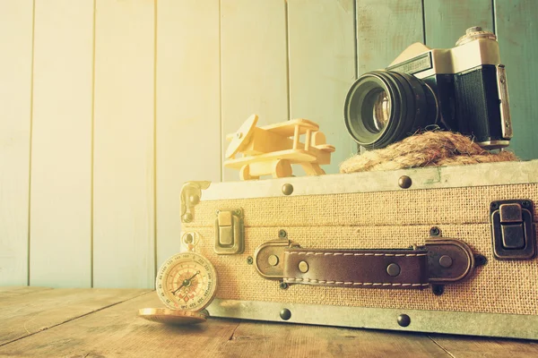 Compass, rope, old camera and toy plane. explorer concept — Stock Photo, Image