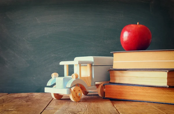 Back to school concept. Blackboard with books — Stock Photo, Image