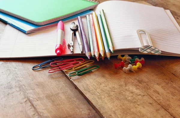 Back to school concept. Writing supplies on wooden desk — Stock Photo, Image