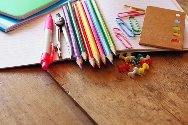 Back to school concept. Writing supplies on wooden desk — Stock Photo, Image