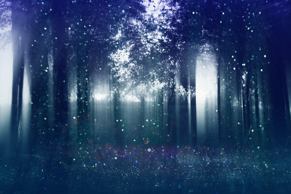 Abstract and mysterious background of blurred forest. Filtered image. Halloween concept