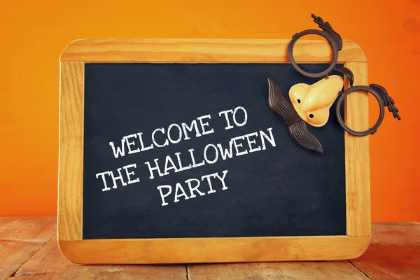 Halloween holiday concept. Blackboard with funny mask — Stock Photo, Image