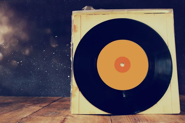 Close up of old records on wooden table — Stock Photo, Image