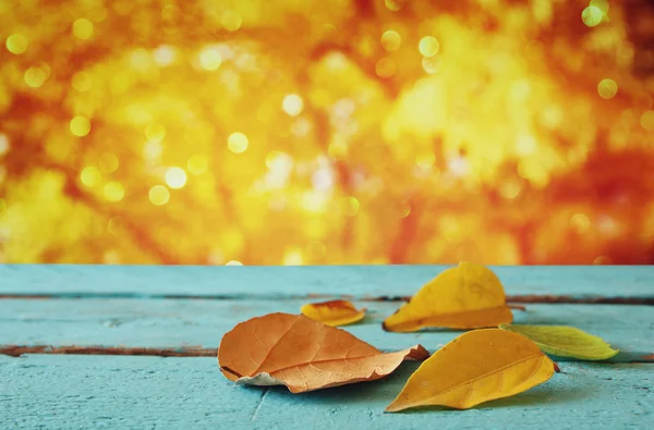 Autumn background with dry leaves on wooden table — Stock Photo, Image