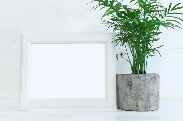 Image White Empty Photo Frame Next Home Plant Wooden Table — Stock Photo, Image
